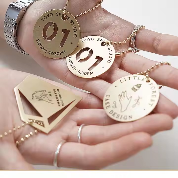 Luxury OEM Nickle Free Fittings Metallic Emboss Logo Tags Custom Tag for Garment Bags Accessories