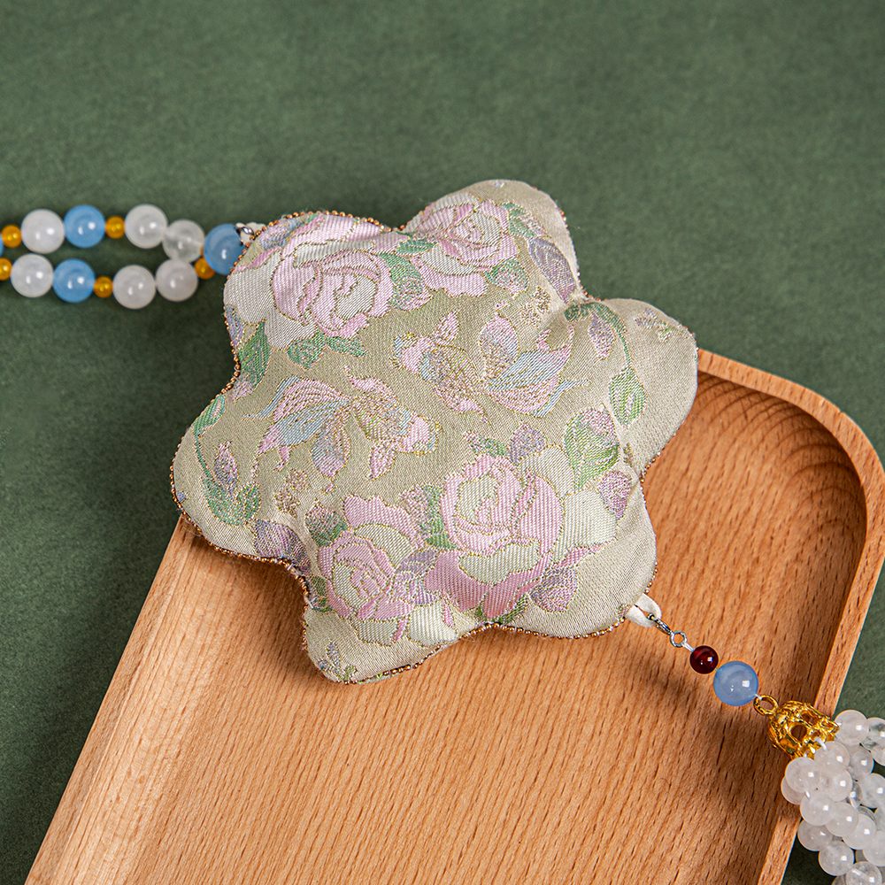 Brocade Holds Elegance; A Scented Pouch Embodies Eastern Poetry